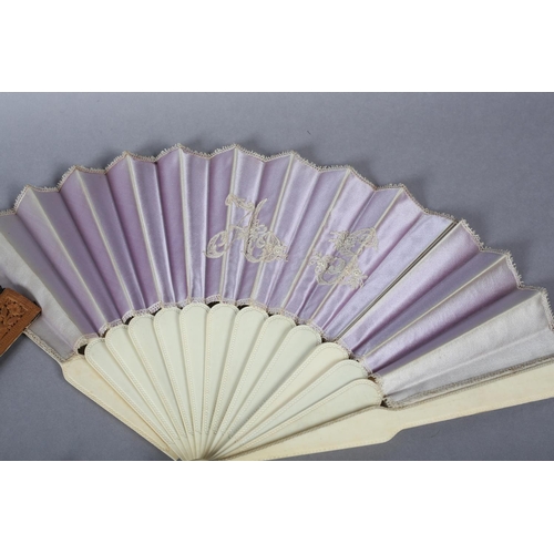 33 - A c.1880’s wood fan, the monture with deeply carved guards, the gorge sticks with simple piercing, m... 