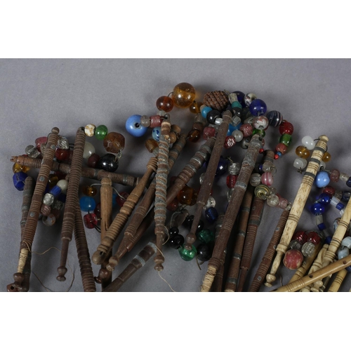 336 - Lace bobbins, a quantity, a mix of turned wood with and without spangles, several with wire decorati... 