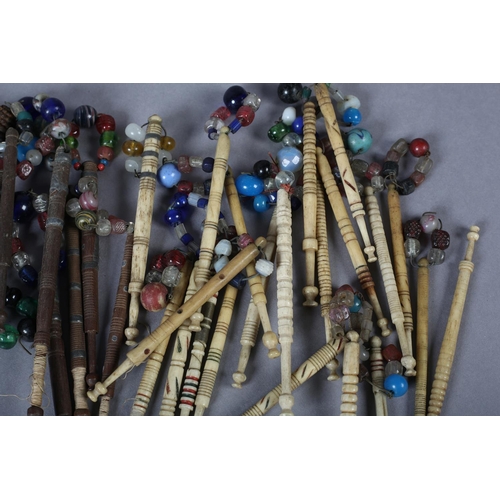 336 - Lace bobbins, a quantity, a mix of turned wood with and without spangles, several with wire decorati... 