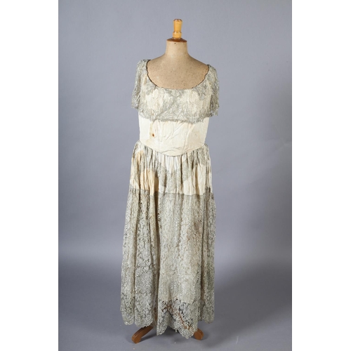 341 - A French silver lamé evening dress, the bodice cream, the lamé formed as a collar and then from wais... 