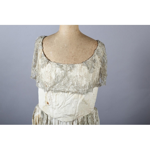 341 - A French silver lamé evening dress, the bodice cream, the lamé formed as a collar and then from wais... 