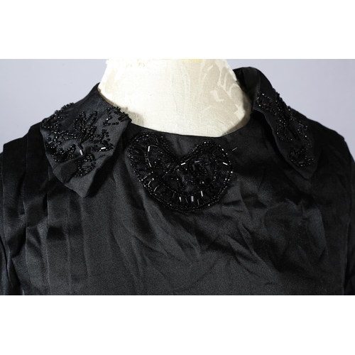 352 - A black silk Edwardian day dress trimmed with beads, together with a moire silk black skirt (2)