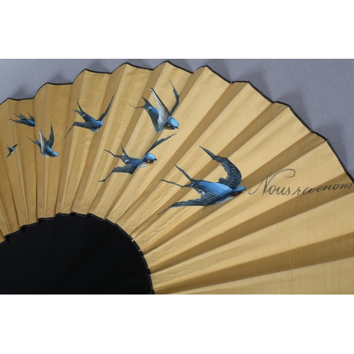 36 - A large and showy mustard silk fan c1890’s, painted with bluebirds in flight and the words “Nous rev... 