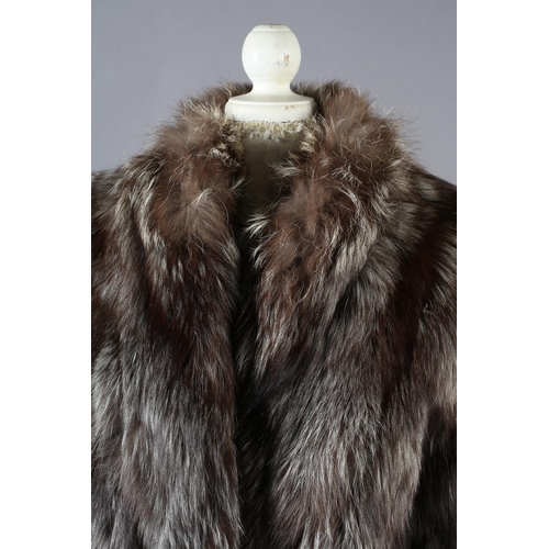 367 - Silver fox: a three- quarter length silver fox jacket in cape form, the front and back dipping in th... 