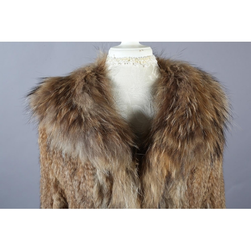 368 - A stylish tan fur jacket, hip length, labelled Gil Bret, the collar, front and long sleeves trimmed ... 