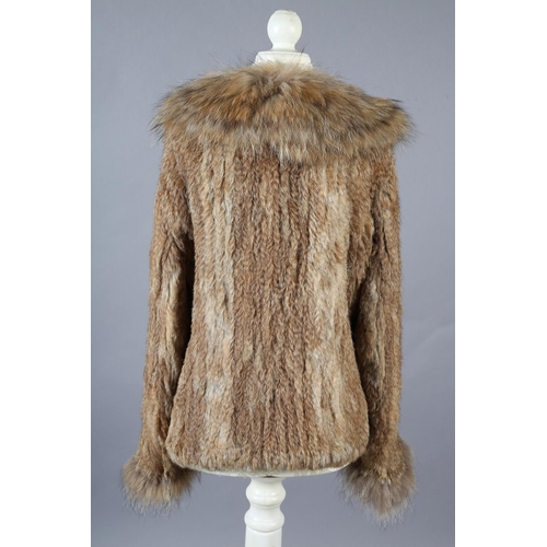 368 - A stylish tan fur jacket, hip length, labelled Gil Bret, the collar, front and long sleeves trimmed ... 