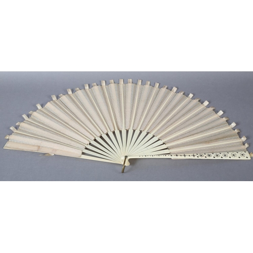 37 - A large late 1890’s fan with unusual cream silk ribbon work detail applied to spotted net, mounted à... 