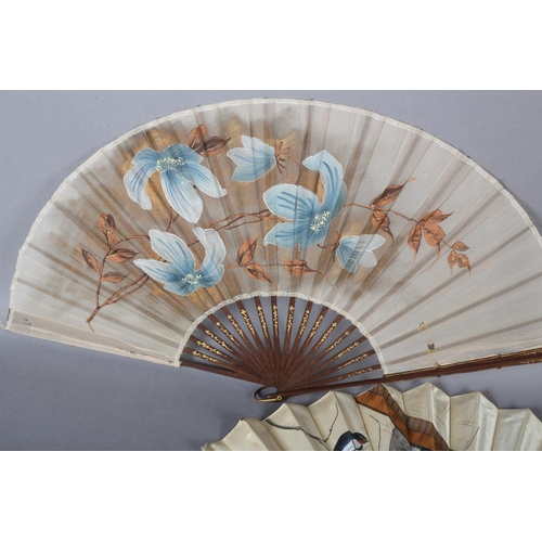 38 - A good late 1890’s wood fan, the cream silk satin leaf panted with birds returning to a nest in the ... 