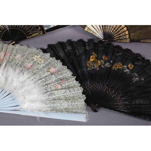 66 - Four fans dating from the 1890’s, the first with a gilded black wood monture, the recto in fabric, l... 