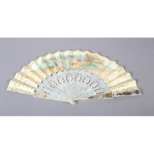 68 - Two white mother of pearl mid-19th century fans, elaborately gilded and silvered, the leaves lithogr... 