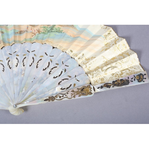 68 - Two white mother of pearl mid-19th century fans, elaborately gilded and silvered, the leaves lithogr... 