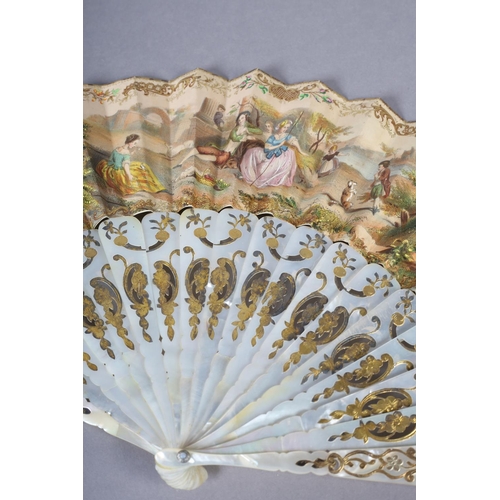 68 - Two white mother of pearl mid-19th century fans, elaborately gilded and silvered, the leaves lithogr... 