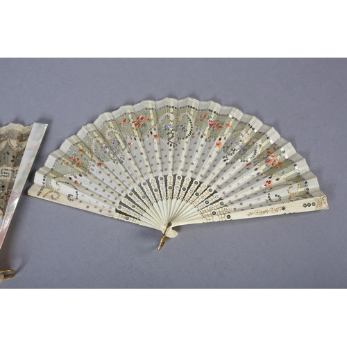 73 - A good c.1900 light pink mother of pearl fan, the leaf of gold lamé overlaid with cream silk, cut aw... 