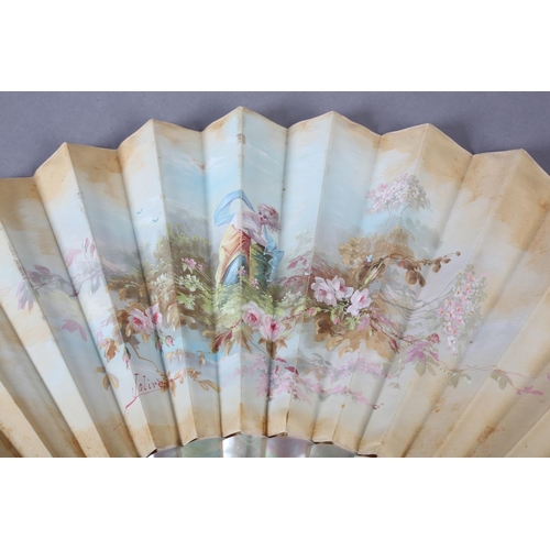 88 - A painted silk fan signed “Jolivet”, the cream leaf painted with a solitary maiden in a garden surro... 