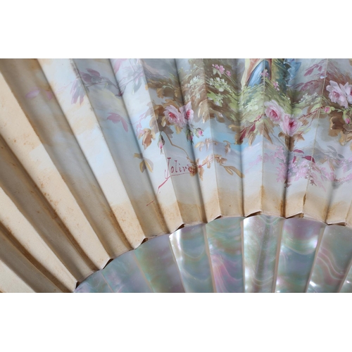 88 - A painted silk fan signed “Jolivet”, the cream leaf painted with a solitary maiden in a garden surro... 