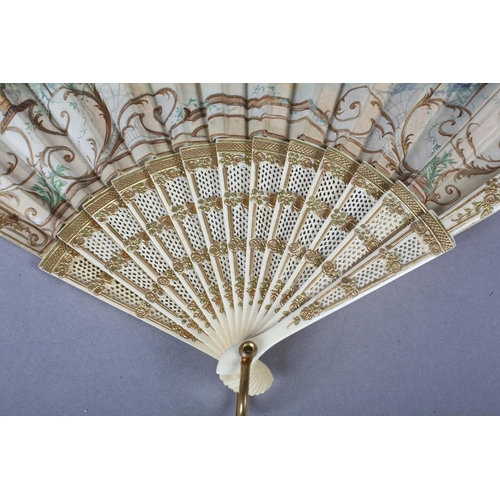 89 - A c.1900 Fan of Fontange Form, the sticks of bone, carved, pierced, shaped and gilded, mounted with ... 