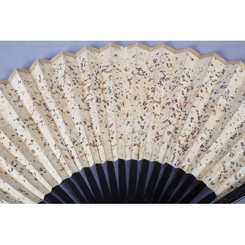 92C - An unusual, large, Chinese fan, Qing Dynasty, the monture wood, with black lacquer, the guards featu... 