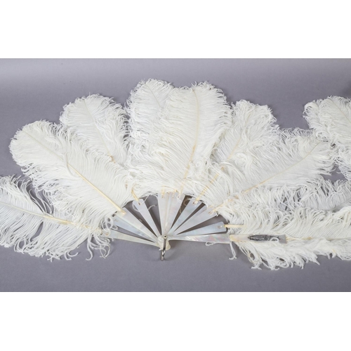 97 - A late 19th century white ostrich feather fan, the monture of white mother of pearl, plain other tha... 