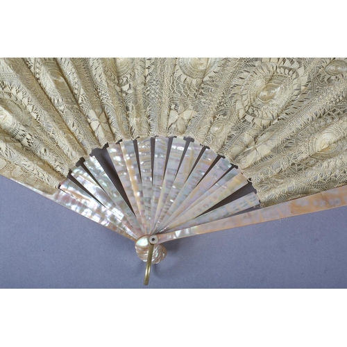 145 - Tenerife or Sol handmade lace: a pink mother of pearl fan mounted with a lemon silk leaf formed with... 