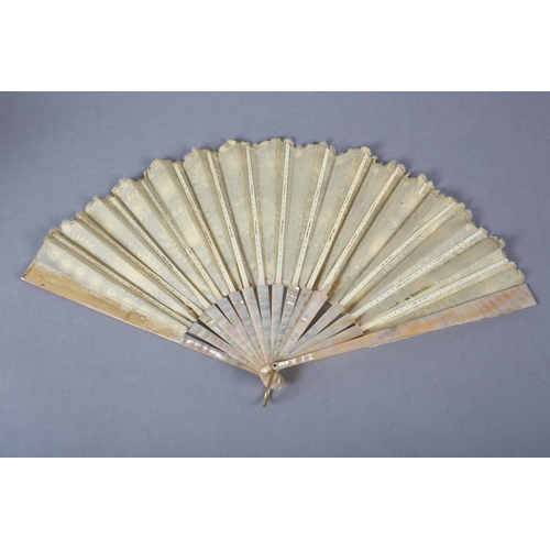 145 - Tenerife or Sol handmade lace: a pink mother of pearl fan mounted with a lemon silk leaf formed with... 