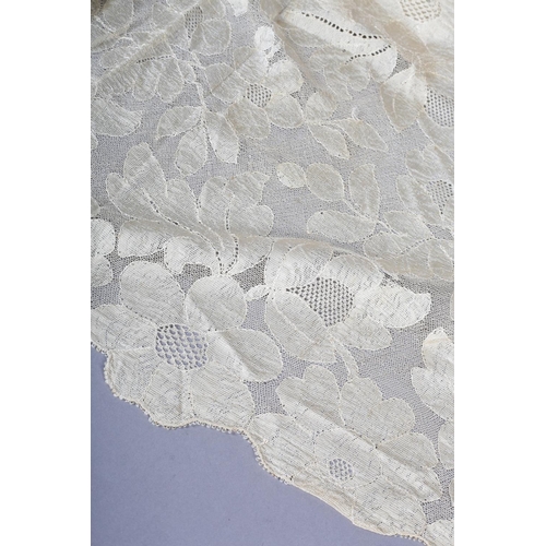 210 - Antique lace: A triangular shawl in embroidered net, with deeper detail to the back point (neck to p... 