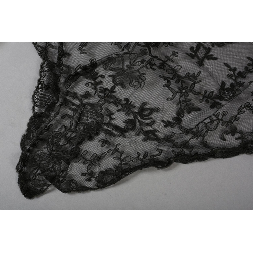 210 - Antique lace: A triangular shawl in embroidered net, with deeper detail to the back point (neck to p... 