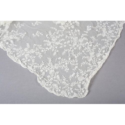 210 - Antique lace: A triangular shawl in embroidered net, with deeper detail to the back point (neck to p... 