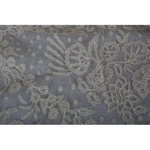 213 - A very fine Limerick wedding veil, 19th century, with detailed fillings, floral design, backed in fi... 