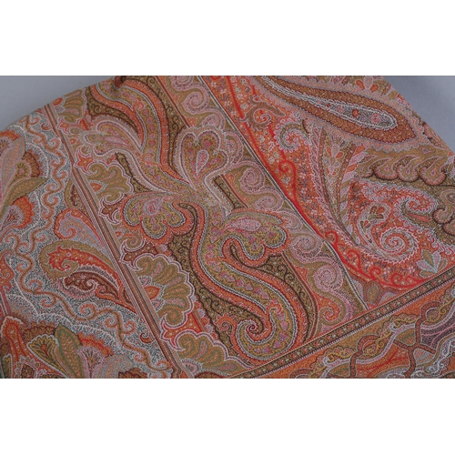 253 - A very fine Paisley or French Long Shawl, with a very tight weave, a red cross to the centre, intric... 