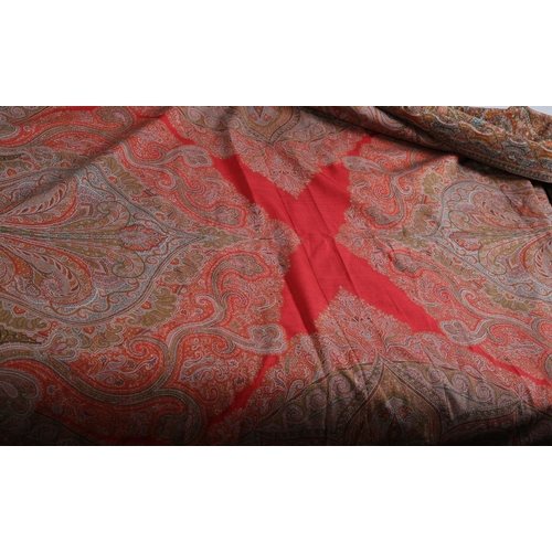 253 - A very fine Paisley or French Long Shawl, with a very tight weave, a red cross to the centre, intric... 