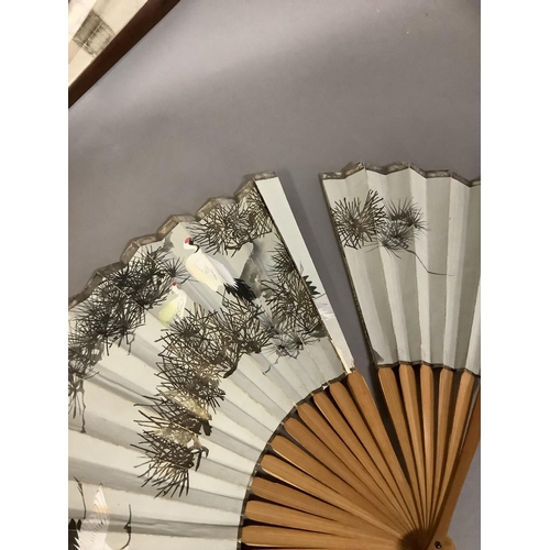 131 - Chinese and Japanese fans: an interesting assortment, to include a wood brisé painted with birds in ... 