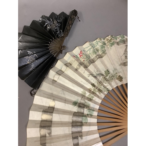 131 - Chinese and Japanese fans: an interesting assortment, to include a wood brisé painted with birds in ... 