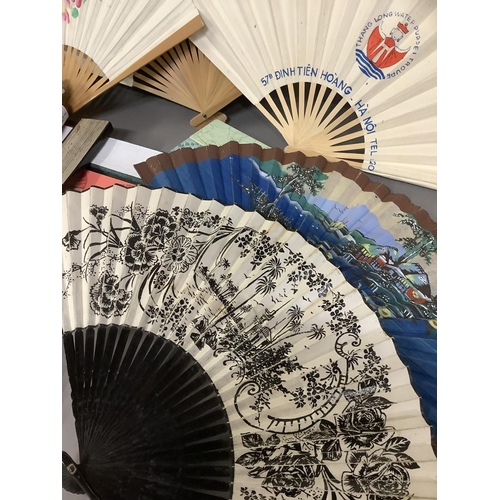 135C - A large selection of Chinese tourist fans, from the 20th century, one very large with birds and blos... 