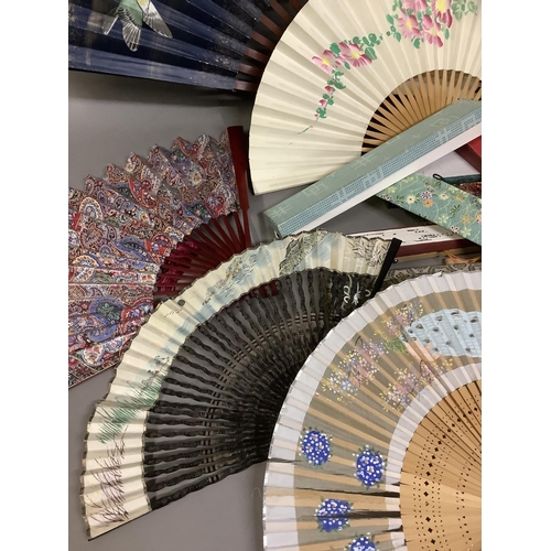 135C - A large selection of Chinese tourist fans, from the 20th century, one very large with birds and blos... 