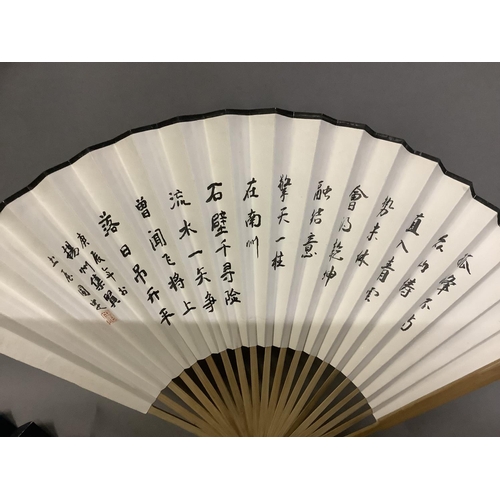 135C - A large selection of Chinese tourist fans, from the 20th century, one very large with birds and blos... 