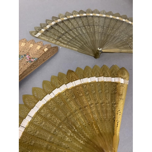 141 - Three early 19th century brisé fans, Jane Austen period, the first with original card tube, the fan ... 