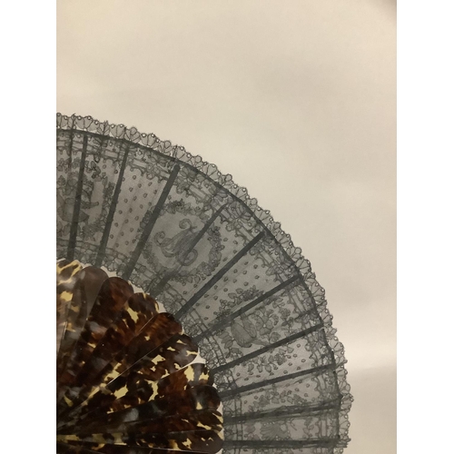 142 - A tortoiseshell fan, c 1880’s with good mottling, mounted with a black handmade lace leaf, the desig... 