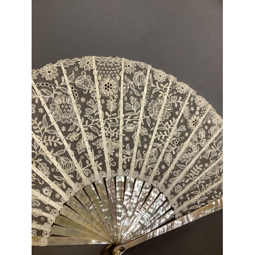 144 - Limerick: a c1900, 1910 handmade lace fan, Limerick embroidered net, with good fillings, the leaf mo... 