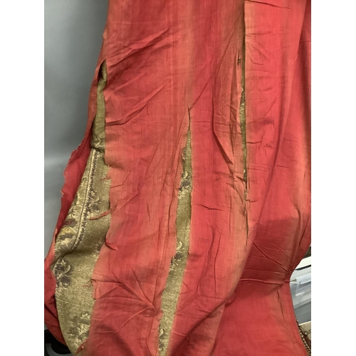 189 - A pair of extremely long French curtains, in ruby with a floral border design, and a hint of gold th... 