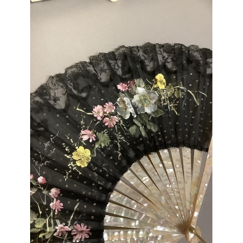 21 - Three late 19th century/early 20th century fans, the first with black gauze and machine lace leaf, p... 