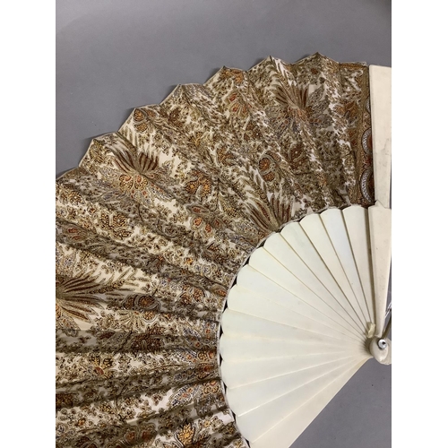 21 - Three late 19th century/early 20th century fans, the first with black gauze and machine lace leaf, p... 