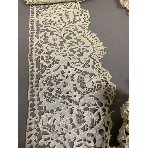 218 - A selection of Irish lace, Carrickmacross, comprising a draped coat of early 20th century form, flou... 