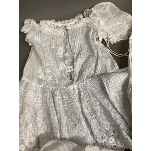 266 - Ayrshire work: A ornate little girl’s white dress, with fine Ayrshire panels, tiered short sleeves; ... 