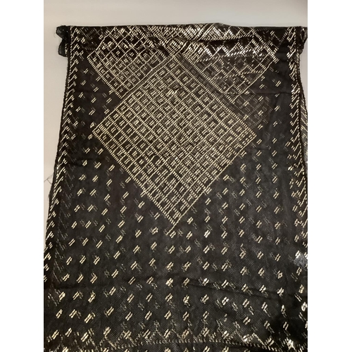 278 - A 1920’s azute or assuit shawl, black net with silver metal geometric design, approx. 255cm x 5cm