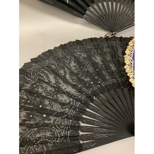 29 - Three large late 19th century evening fans, all mounted on pierced or carved wood, the first with a ... 