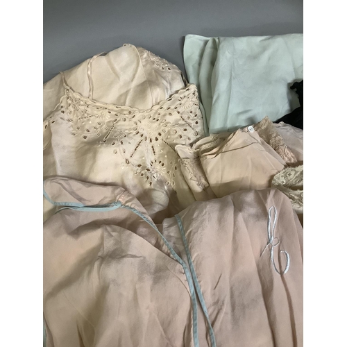 362 - 1920’s and 30’s peach silk lingerie: a sleeveless night gown piped in pale blue; a pair of machine l... 