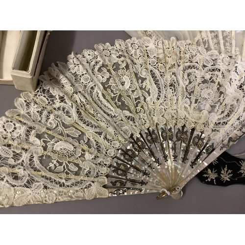 70 - Fans: one late 19th century with gilded mother of pearl monture and painted gauze leaf; a smaller c ... 