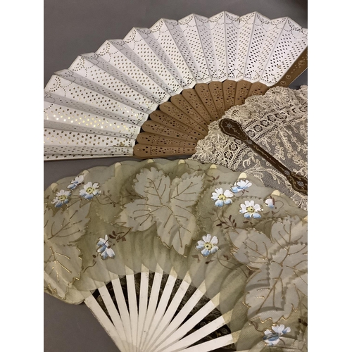 71 - A large late 19th century fan, the dark wood monture shaped, gilded and silvered, the gorge arranged... 