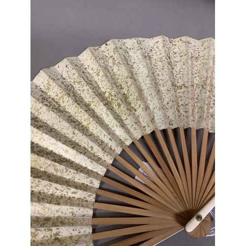 92D - A collection of 20th century Chinese fans, to include two examples with cream gauze leaves, embroide... 