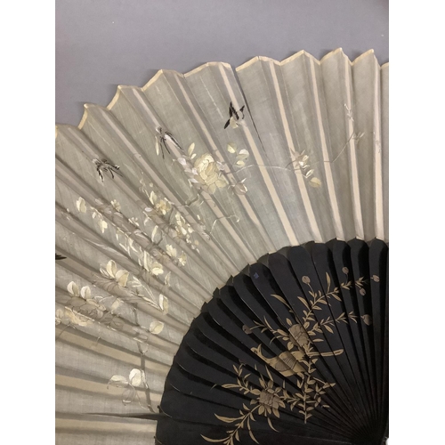 92D - A collection of 20th century Chinese fans, to include two examples with cream gauze leaves, embroide... 